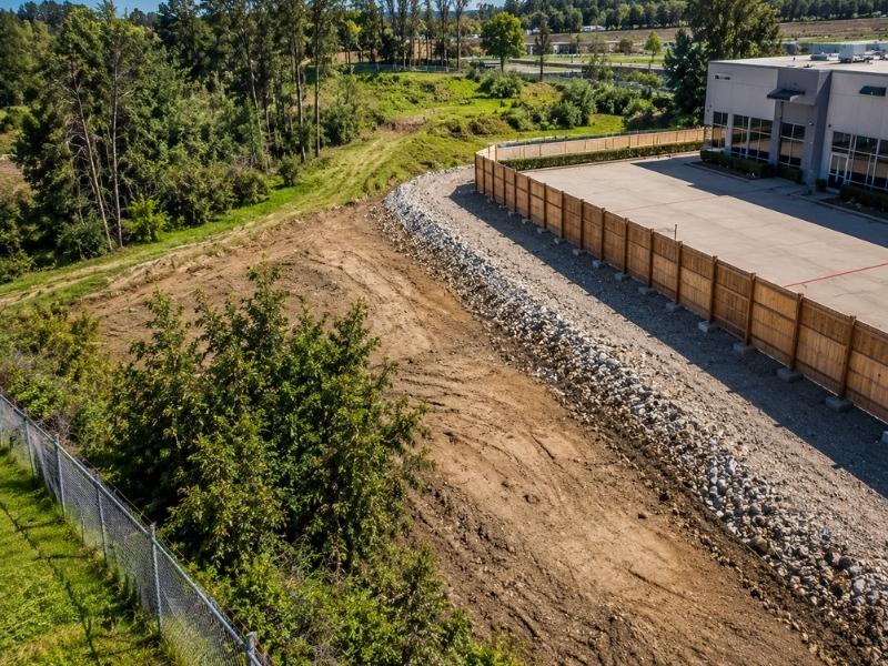 Aerial view of a commercial property showing land boundaries and potential ALTA survey concerns near a developed site